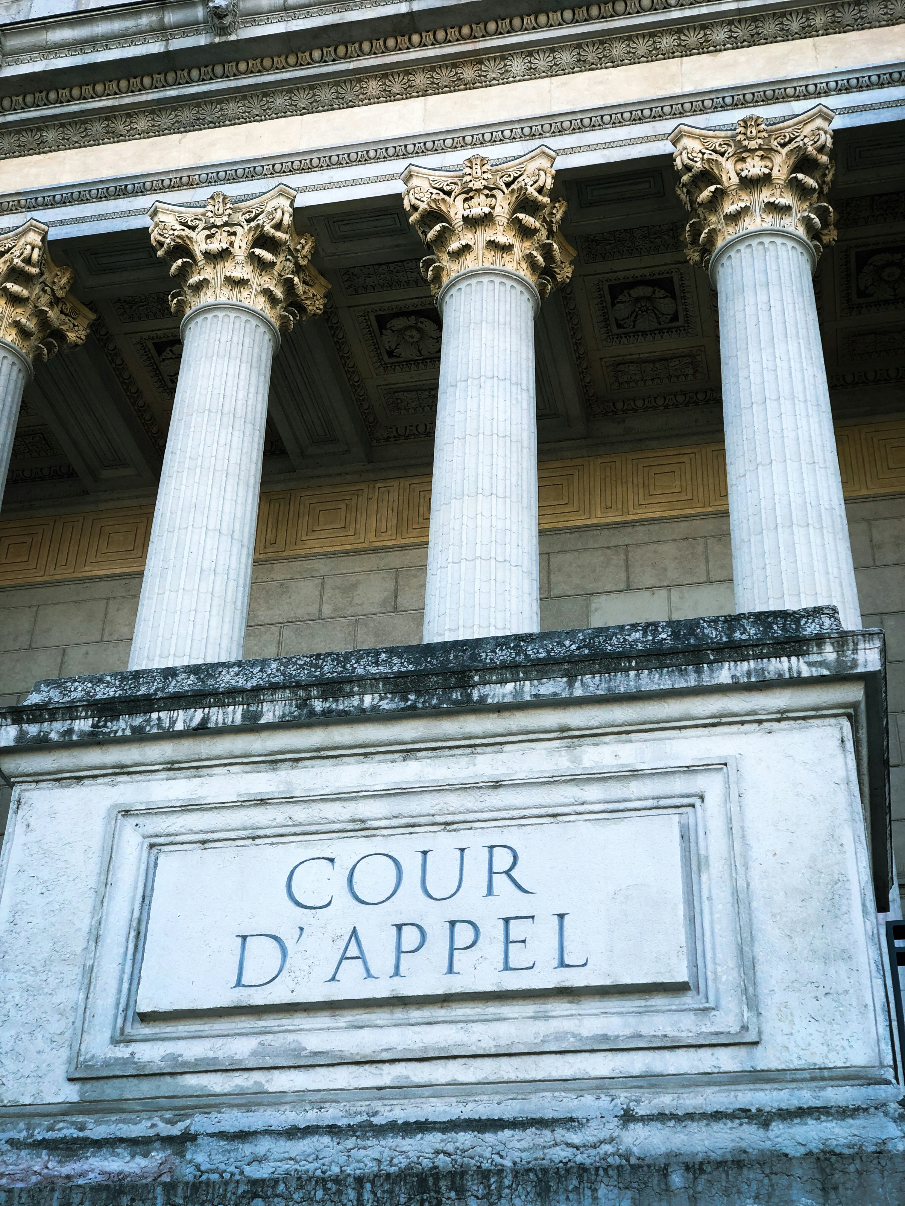 Classical court columns representing litigation services